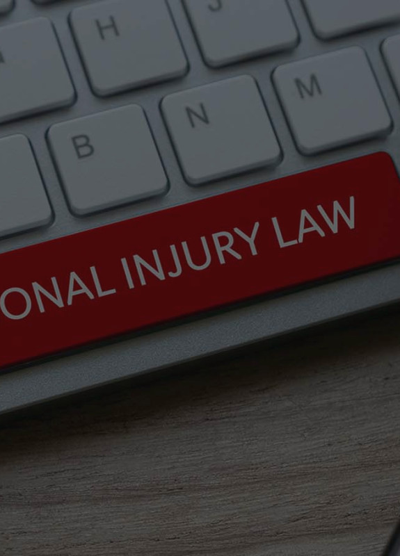 A keyboard with the space bar in red and the words “Personal Injury Law” on it, prompting you to find out what happens after a deposition.