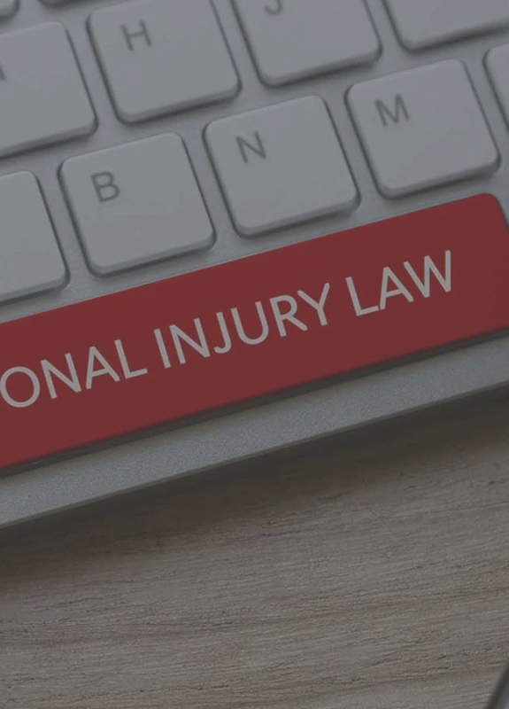 A keyboard with the space bar in red and the words “Personal Injury Law” on it, prompting you to find out what happens after a deposition.